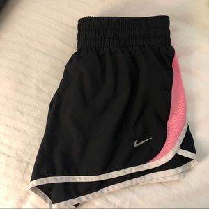 Black and pink Nike running shorts